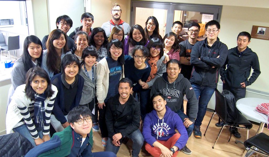 Ian Reid, Palmerston North team leader, with students from Massey Overseas Christian Fellowship.