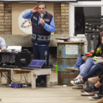 After an evening of hearing from representatives from overseas missions agencies, Nigel Pollock reprised his role as auctioneer in the Ugly Jumper fundraiser for IFES.
