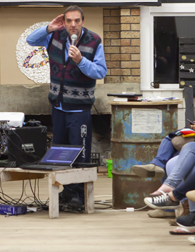 After an evening of hearing from representatives from overseas missions agencies, Nigel Pollock reprised his role as auctioneer in the Ugly Jumper fundraiser for IFES.