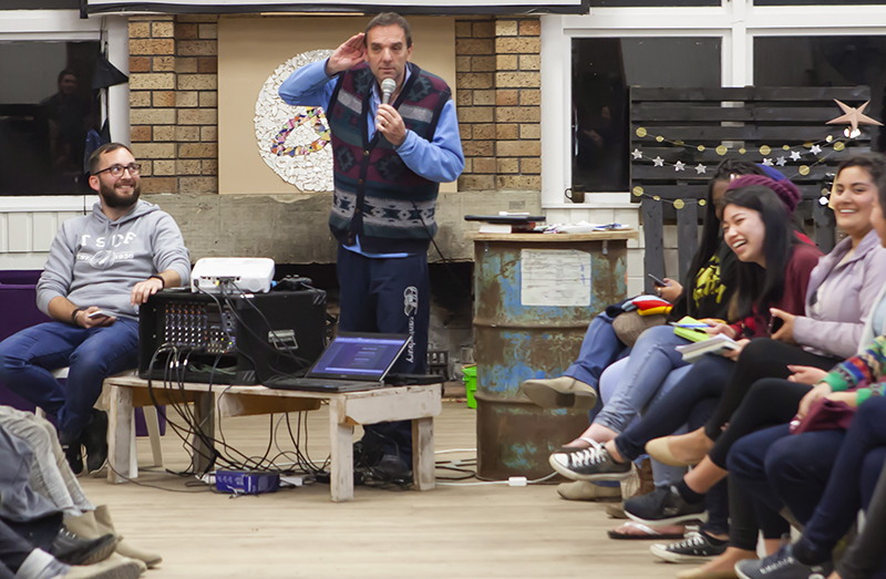 After an evening of hearing from representatives from overseas missions agencies, Nigel Pollock reprised his role as auctioneer in the Ugly Jumper fundraiser for IFES.
